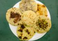 El Salvador Pupusa image. A plate with different types of pupusa.