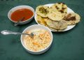 How to make pupusas recipe. The image shows cooked pupusas curtido and salsa roja