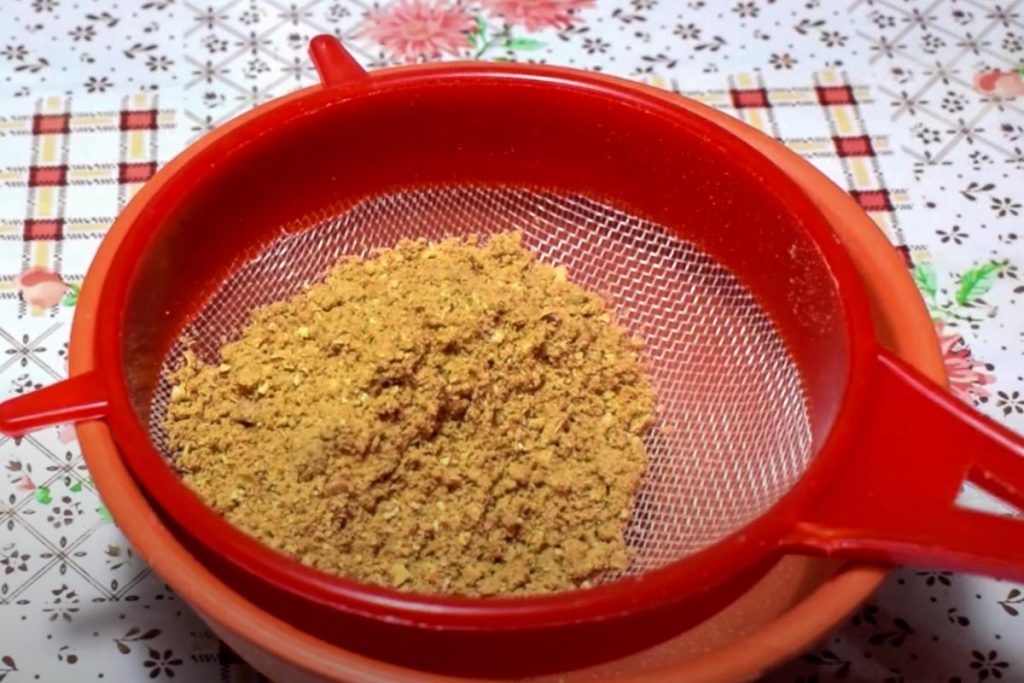 To prepare Alguashte, strain the ground pumpkin seeds to remove any fibrous bits.