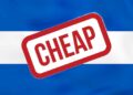 A stamp saying cheap on the flag of El Salvdor is used to illustrate the subject of the post is El Salvador cheap?
